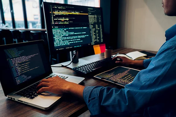 depositphotos_243120806-stock-photo-programmer-working-in-a-software